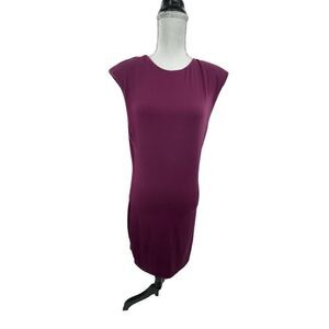 Socialite sleeveless body con dress with cap shoulder pads.